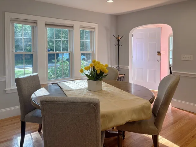 a dining room with furniture and window