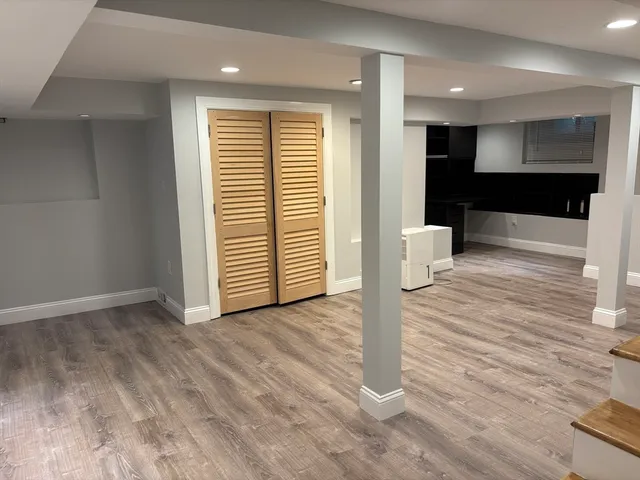 a view of a room with a wooden floor