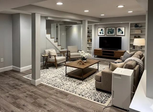 a living room with furniture and a flat screen tv