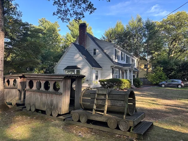 a front view of a house with parking space