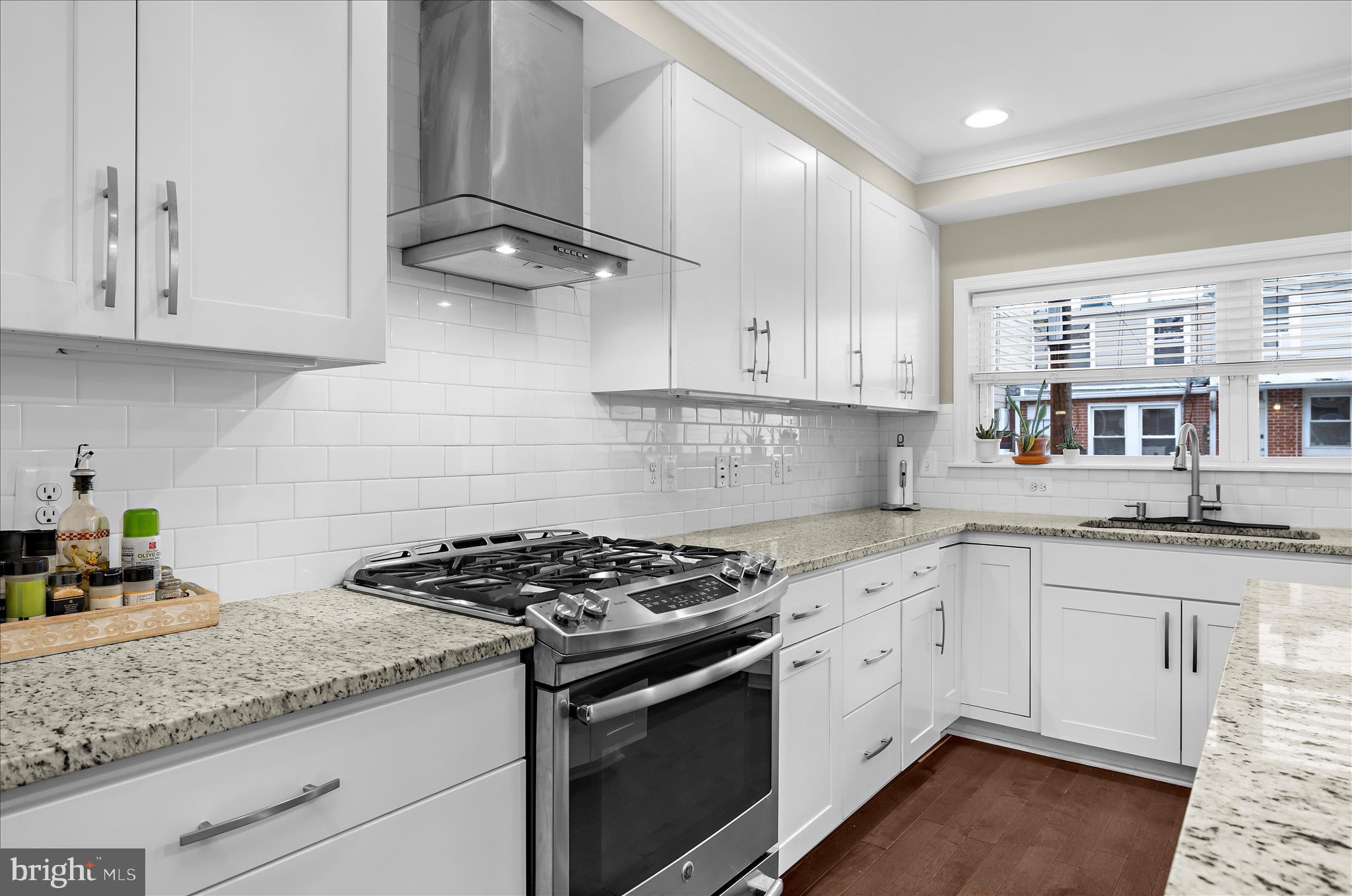 932 South Clinton Street Baltimore, MD 21224 - Photo 12 of 46 a kitchen with stainless steel appliances granite countertop a sink stove and cabinets