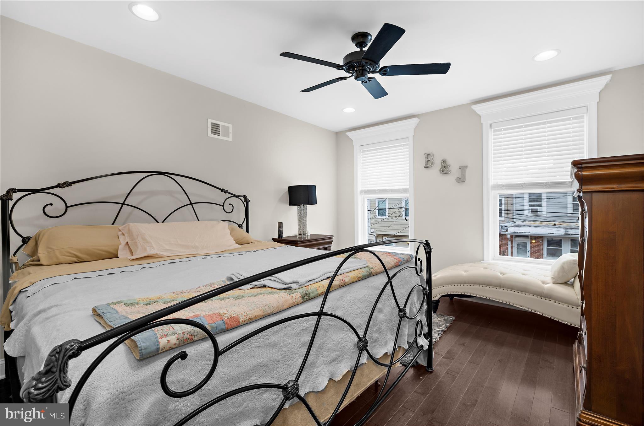 932 South Clinton Street Baltimore, MD 21224 - Photo 13 of 46 a bedroom that has a bed and a chandelier