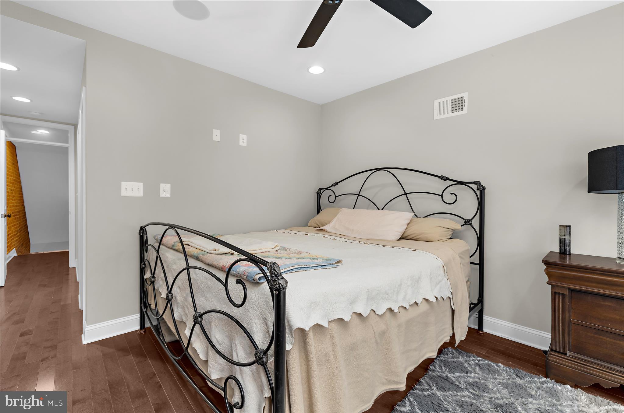 932 South Clinton Street Baltimore, MD 21224 - Photo 14 of 46 a bedroom with a bed and a television