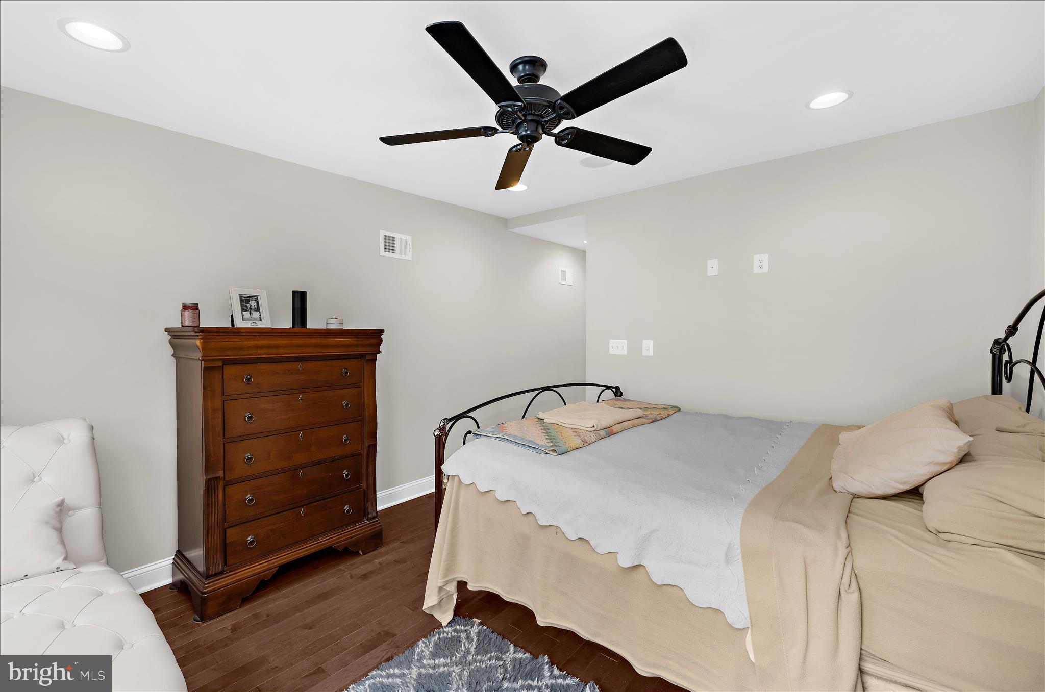 932 South Clinton Street Baltimore, MD 21224 - Photo 15 of 46 a bedroom with a bed and furniture