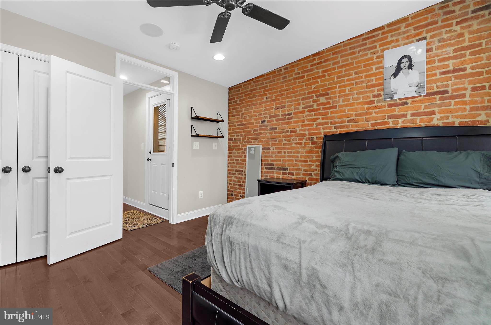 932 South Clinton Street Baltimore, MD 21224 - Photo 22 of 46 a bedroom with a bed and a dresser