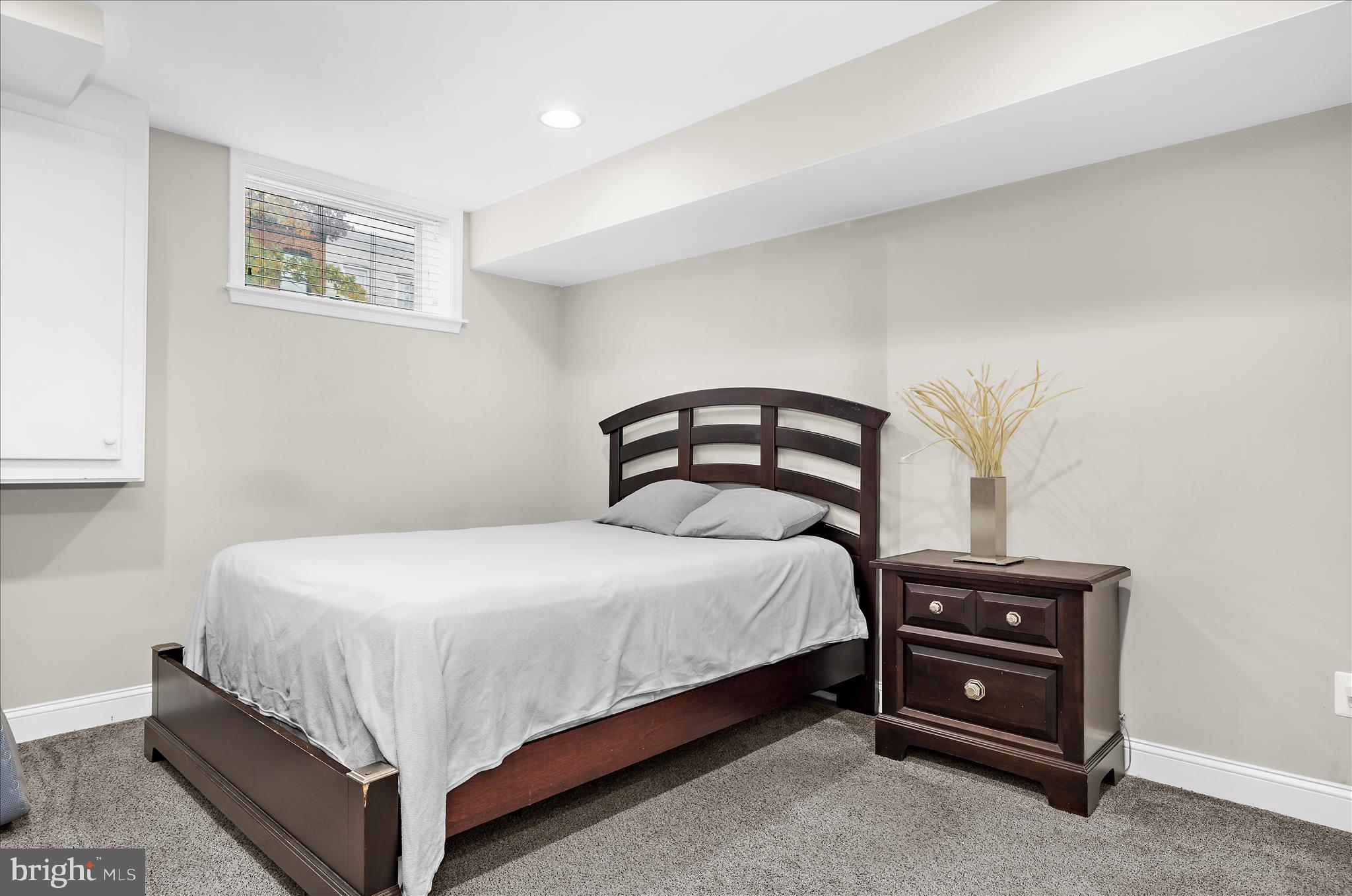 932 South Clinton Street Baltimore, MD 21224 - Photo 26 of 46 a bedroom with a bed and a window