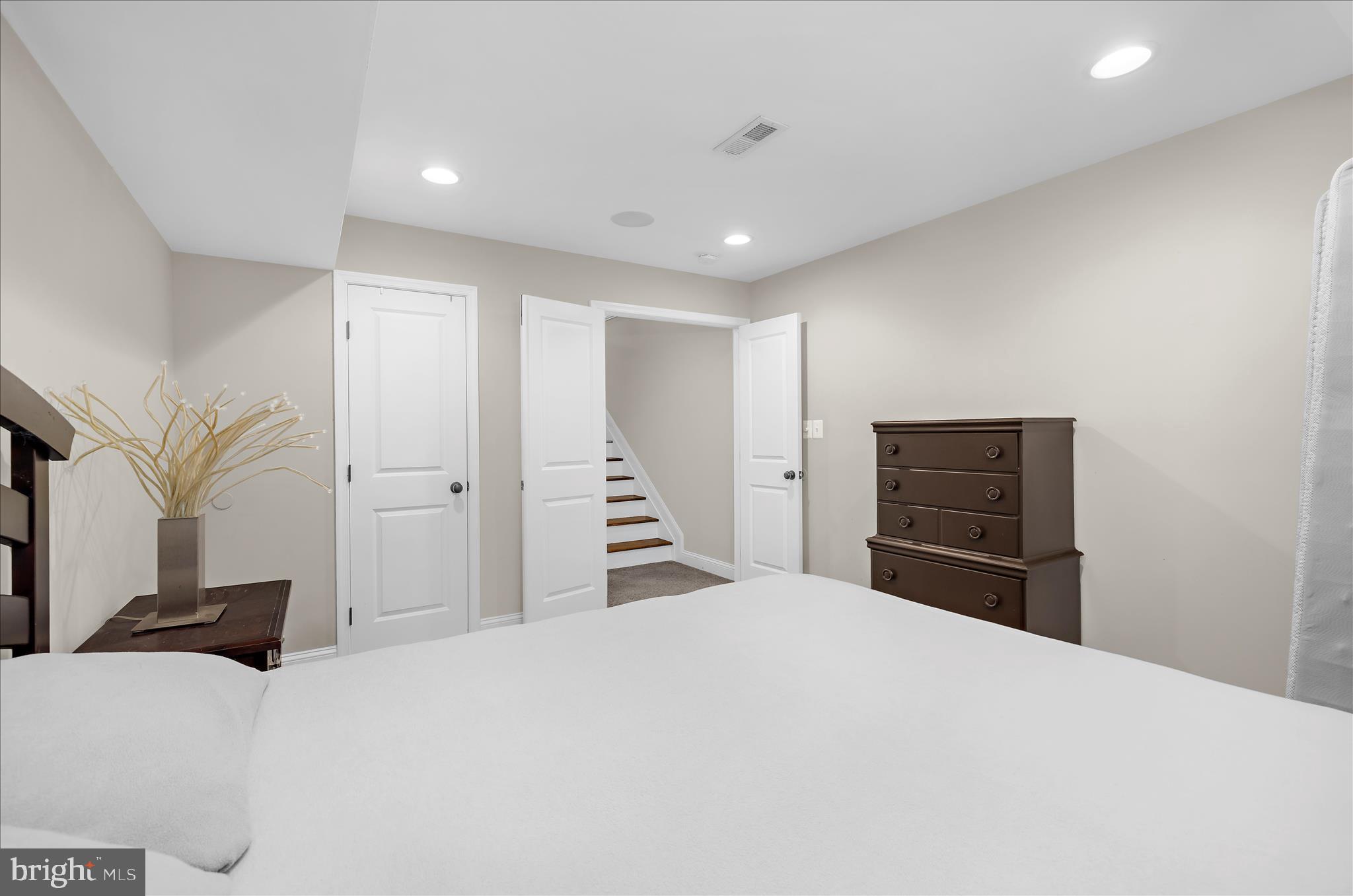 932 South Clinton Street Baltimore, MD 21224 - Photo 27 of 46 a bedroom with a bed and a flat screen tv