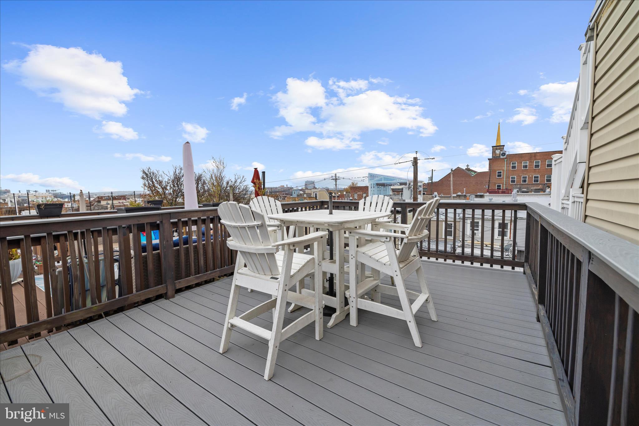 932 South Clinton Street Baltimore, MD 21224 - Photo 32 of 46 a view of a chairs on wooden deck