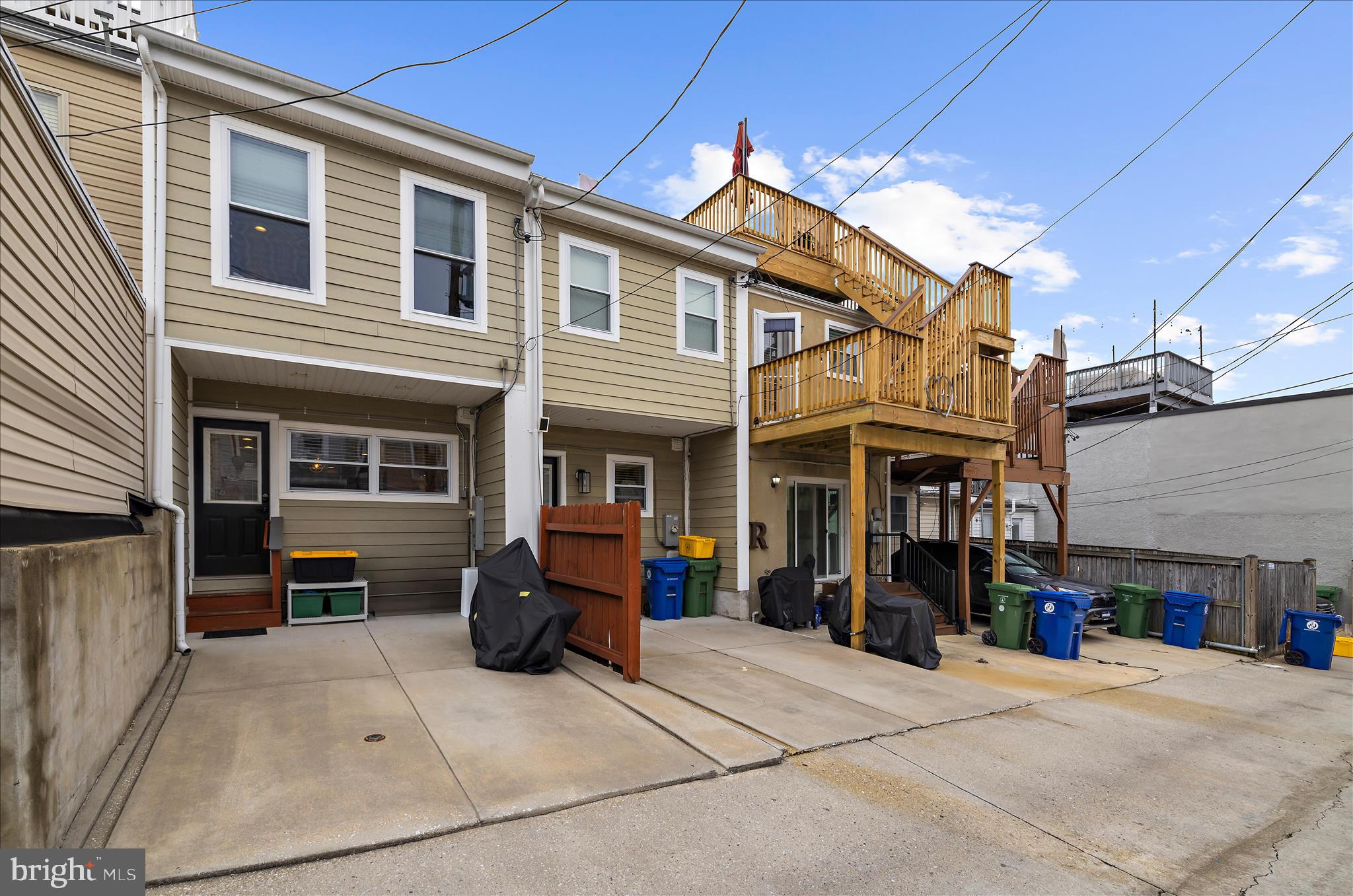 932 South Clinton Street Baltimore, MD 21224 - Photo 34 of 46 a view of the house with a barbeque and bench