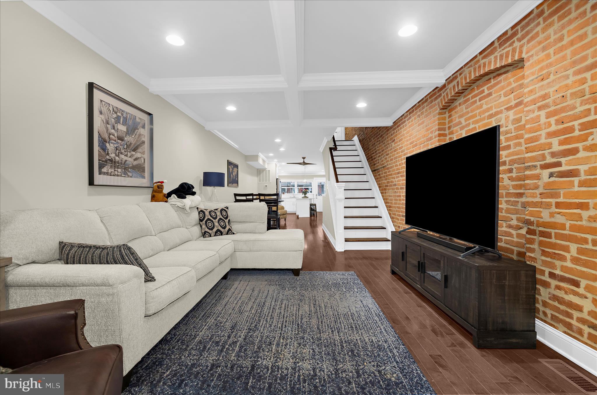 932 South Clinton Street Baltimore, MD 21224 - Photo 6 of 46 a living room with furniture and a flat screen tv