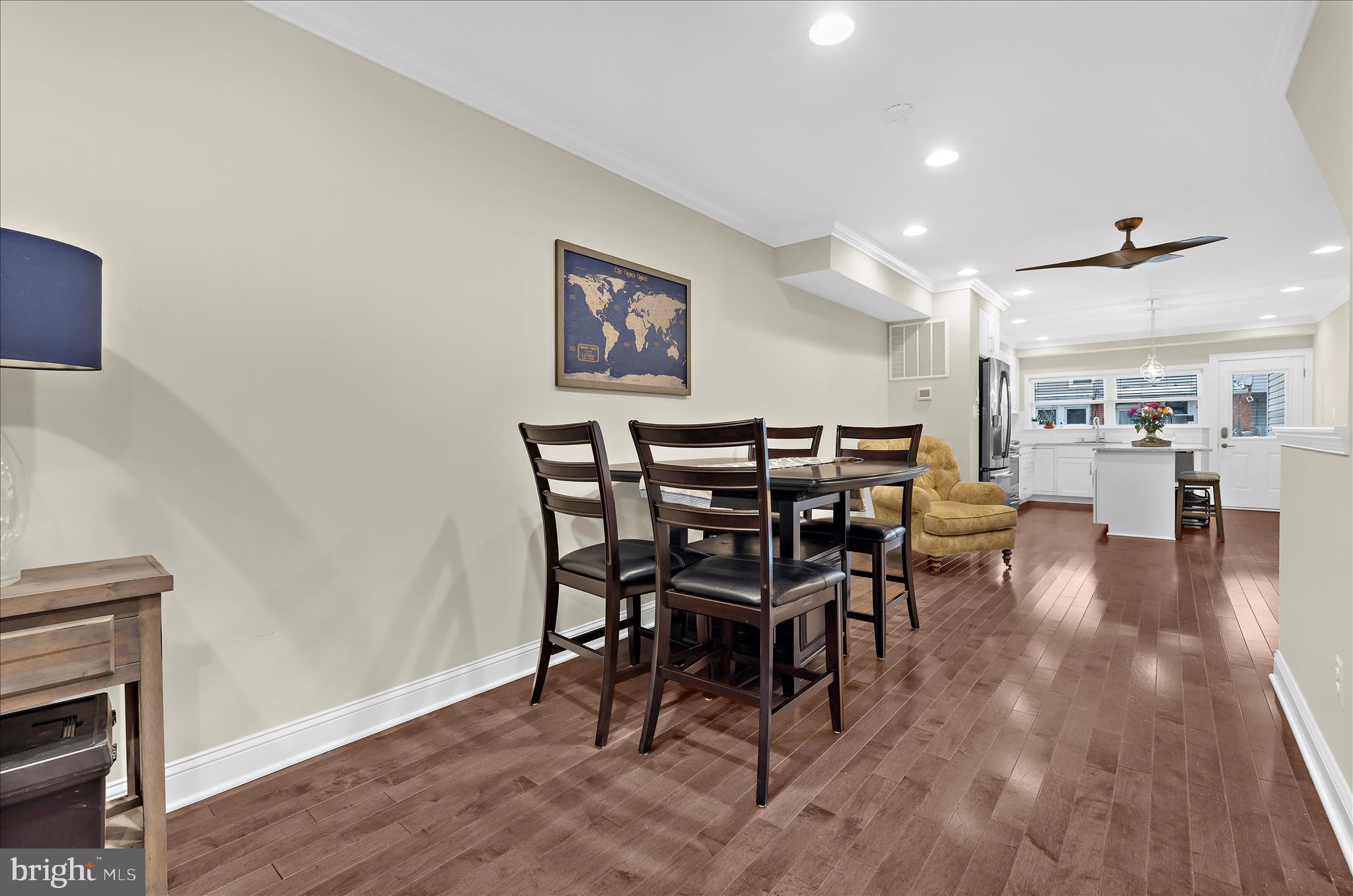932 South Clinton Street Baltimore, MD 21224 - Photo 8 of 46 a view of a dining room with furniture and wooden floor