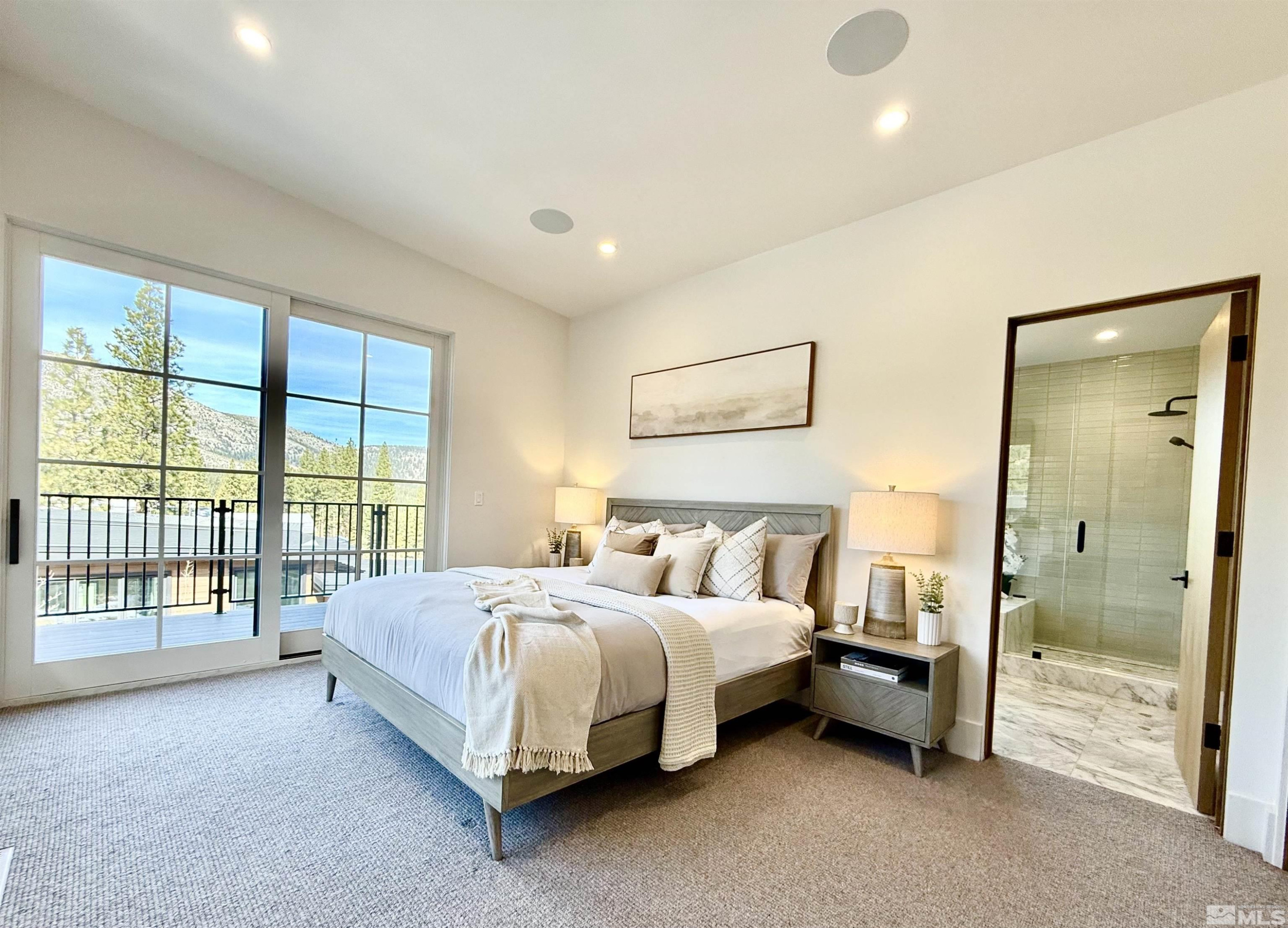 265 Mill Race Loop Carson City, NV 89705 - Photo 20 of 40 a spacious bedroom with a bed and a large window