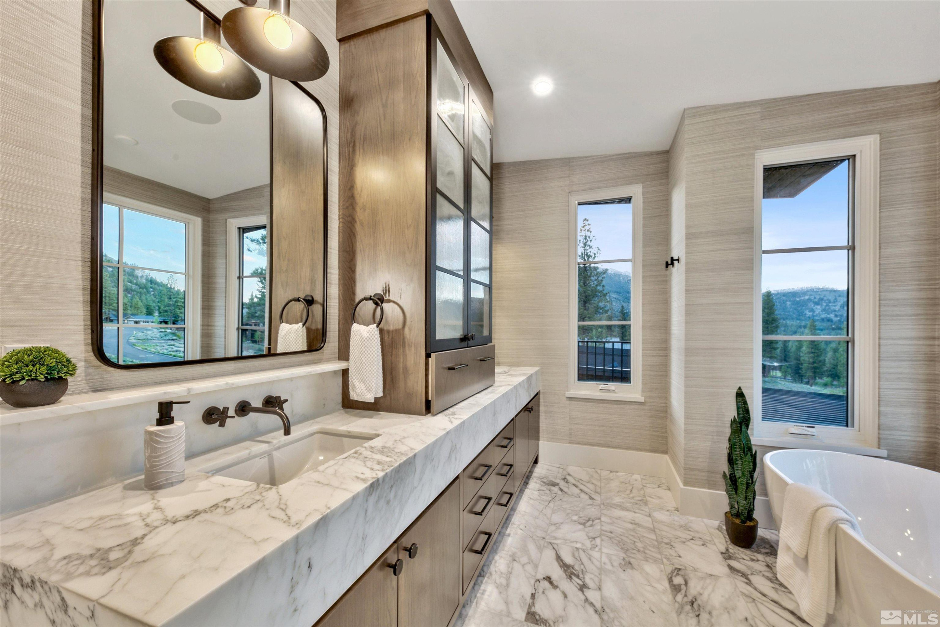 265 Mill Race Loop Carson City, NV 89705 - Photo 22 of 40 a bathroom with a granite countertop sink and a large mirror