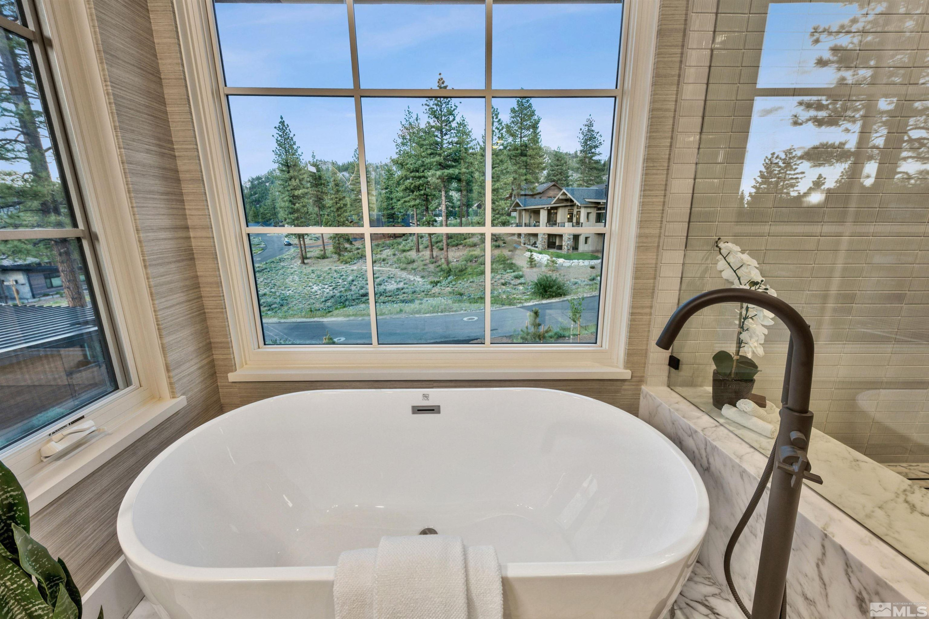 265 Mill Race Loop Carson City, NV 89705 - Photo 23 of 40 a white bath tub sitting in a bathroom next to a window