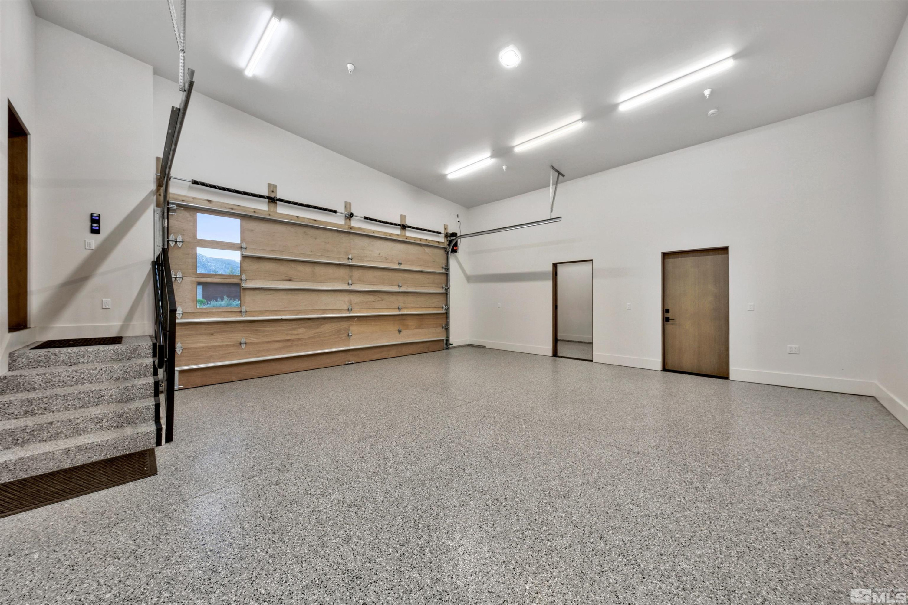 265 Mill Race Loop Carson City, NV 89705 - Photo 33 of 40 a view of room with stairs and a ceiling fan