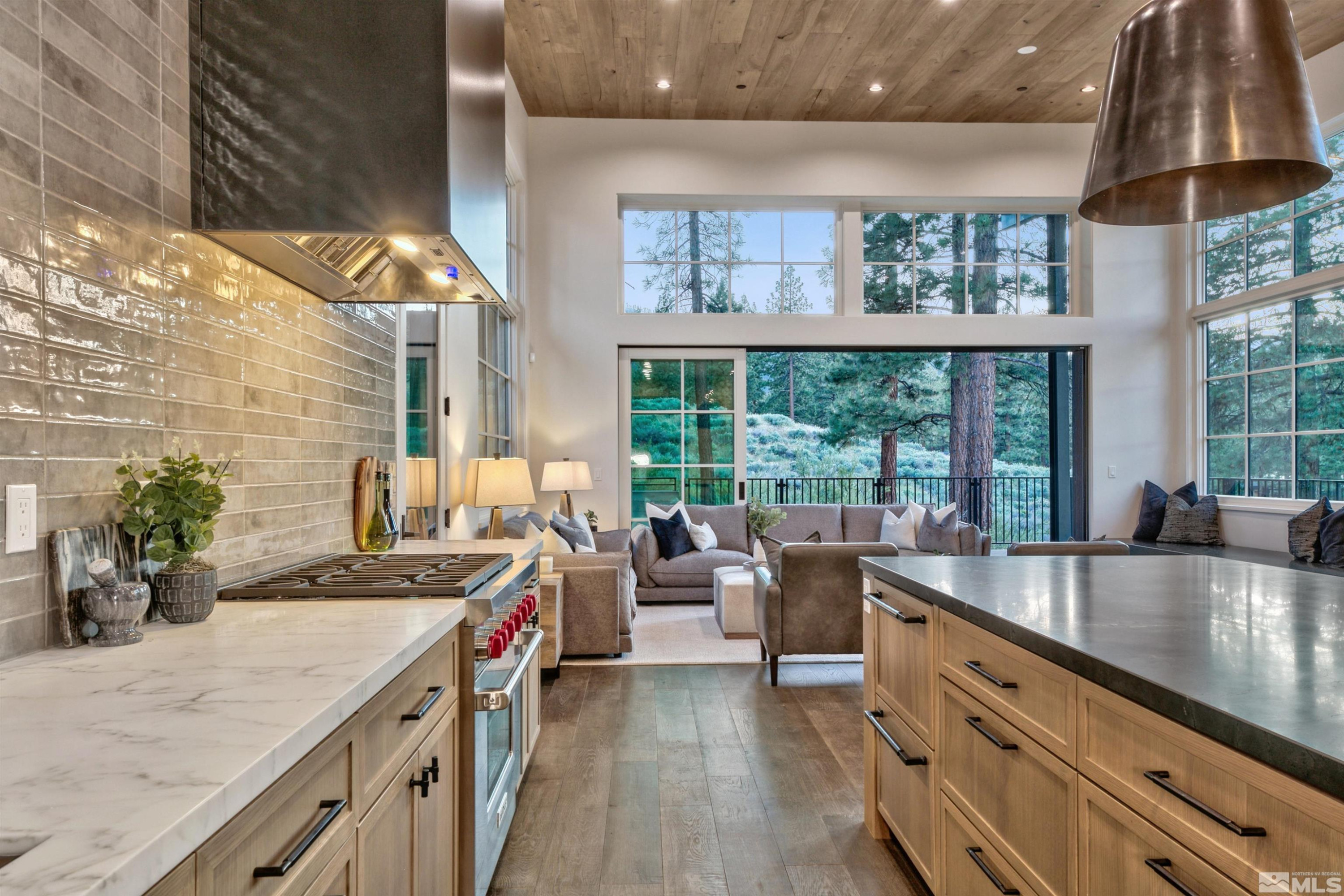 265 Mill Race Loop Carson City, NV 89705 - Photo 6 of 40 a large kitchen with granite countertop a sink and a stove
