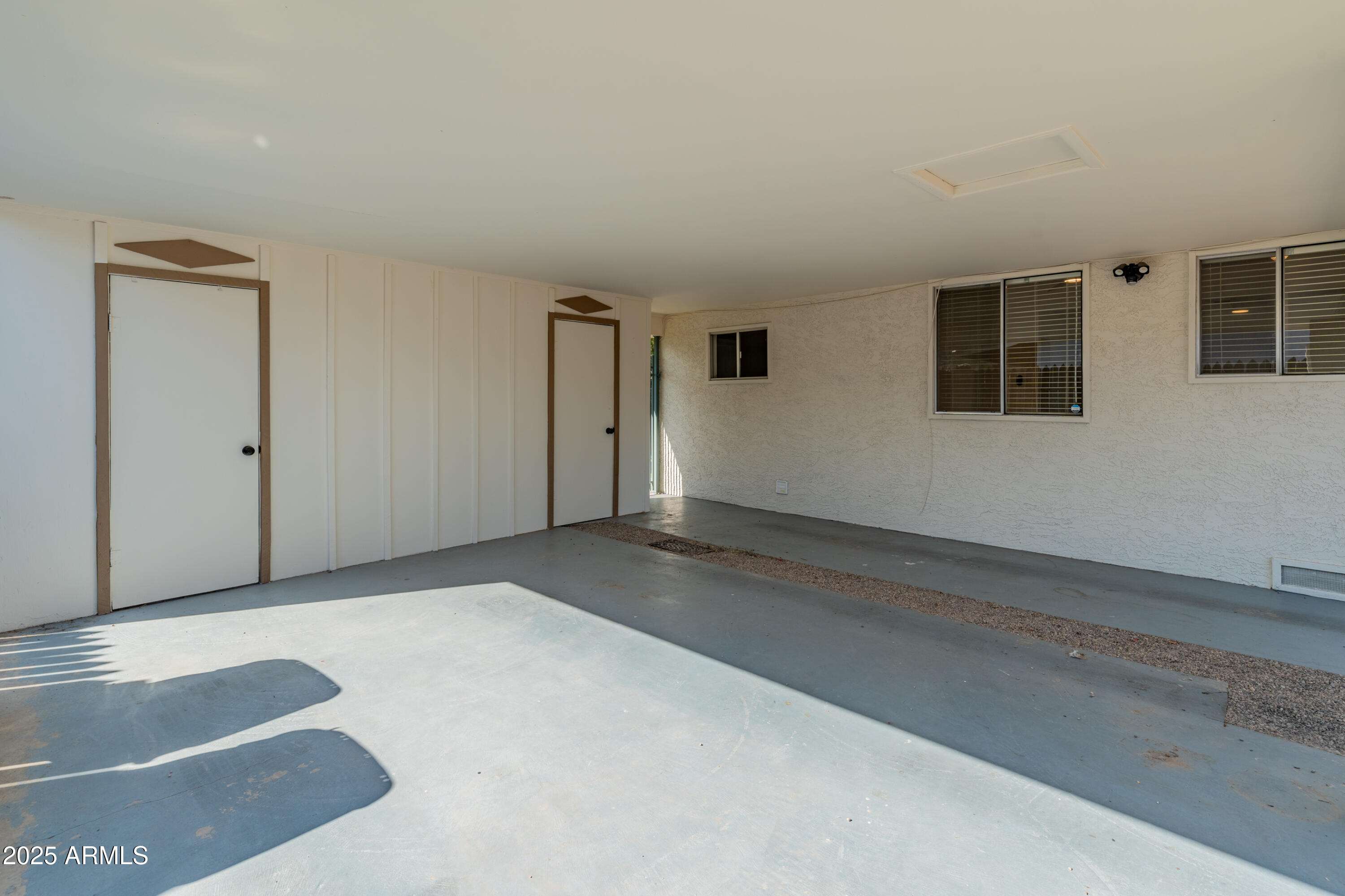 1407 East Mountain View Road Phoenix, AZ 85020 - Photo 33 of 35 an empty room with windows
