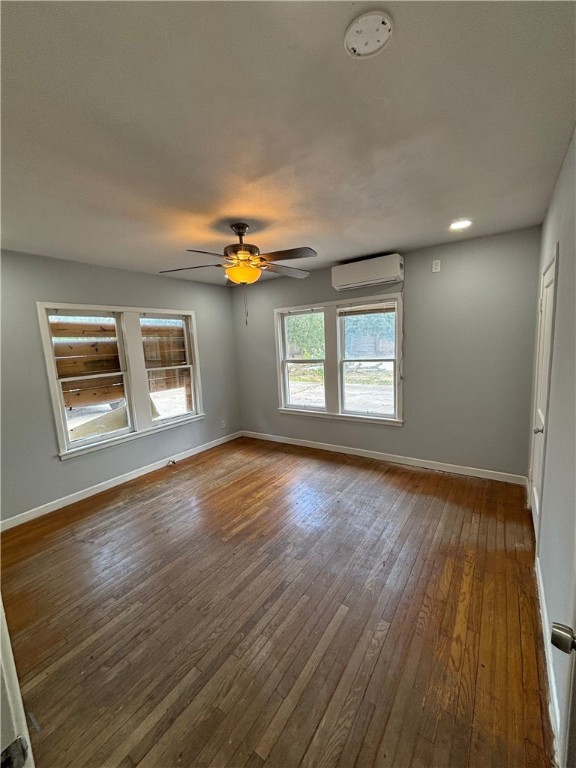4130 Up River Road Corpus Christi, TX 78408 - Photo 4 of 7 a view of an empty room with wooden floor and a window