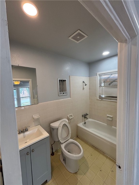 4130 Up River Road Corpus Christi, TX 78408 - Photo 5 of 7 a bathroom with a granite countertop sink mirror vanity and toilet
