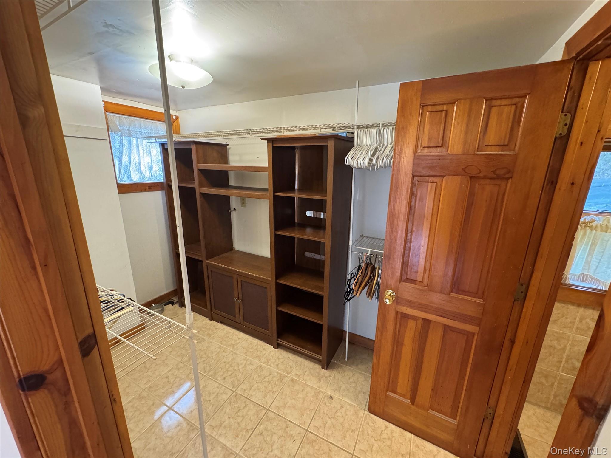 96 White Roe Lake Road Livingston Manor, NY 12758 - Photo 4 of 31 Primary Closet also has washer dryer hookup for future renovations.