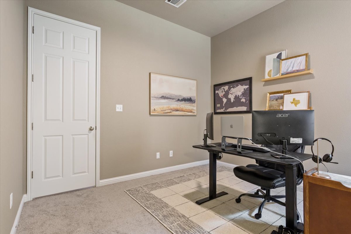 424 Millard Street Georgetown, TX 78628 - Photo 30 of 37 Well-lit and tranquil, this adaptable room presents a quiet space ideal for work or creative pursuits.