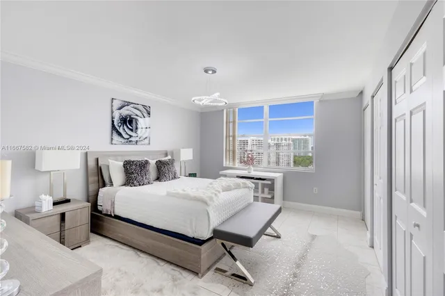 a bedroom with a bed and a table in it