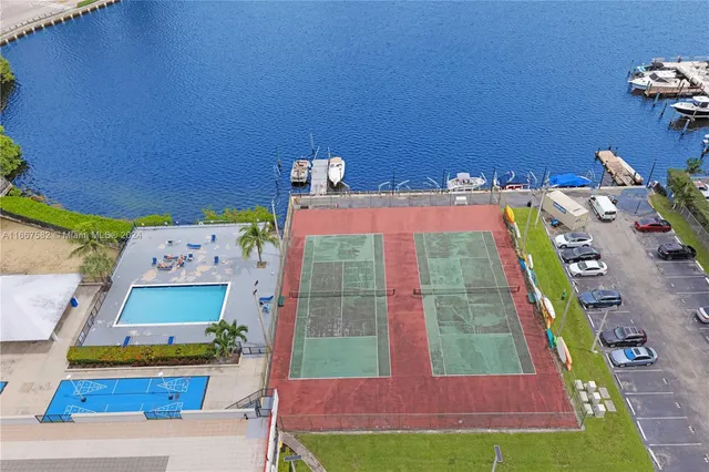 a view of swimming pool with outdoor seating and city view