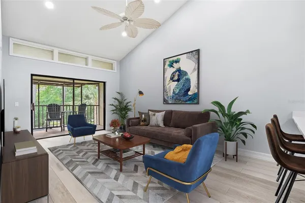 a living room with furniture and a large window