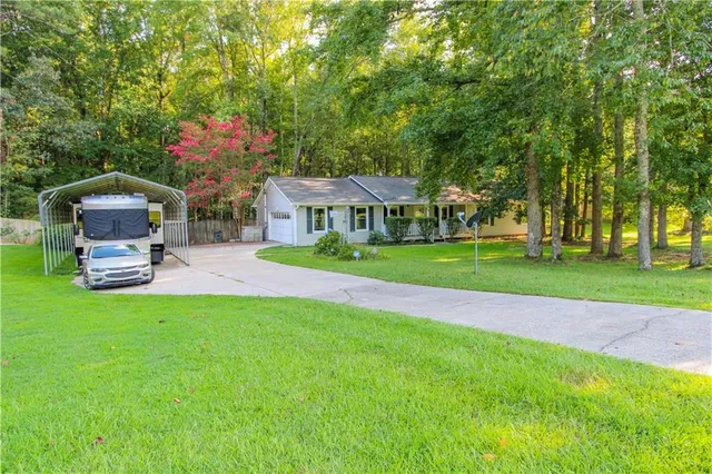 a front view of a house with garden