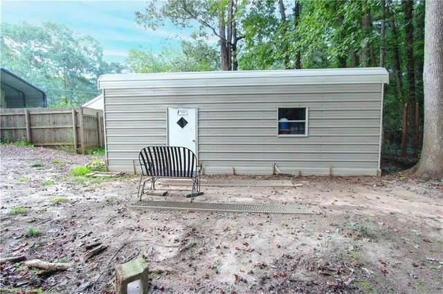 a view of a yard with large trees