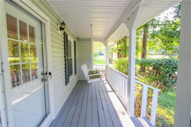 a view of balcony with wooden floor