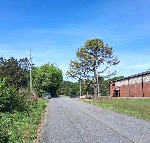 123 West Main Street Kingston, GA 30145 - Photo 2 of 10 a front view of a house with a yard and trees