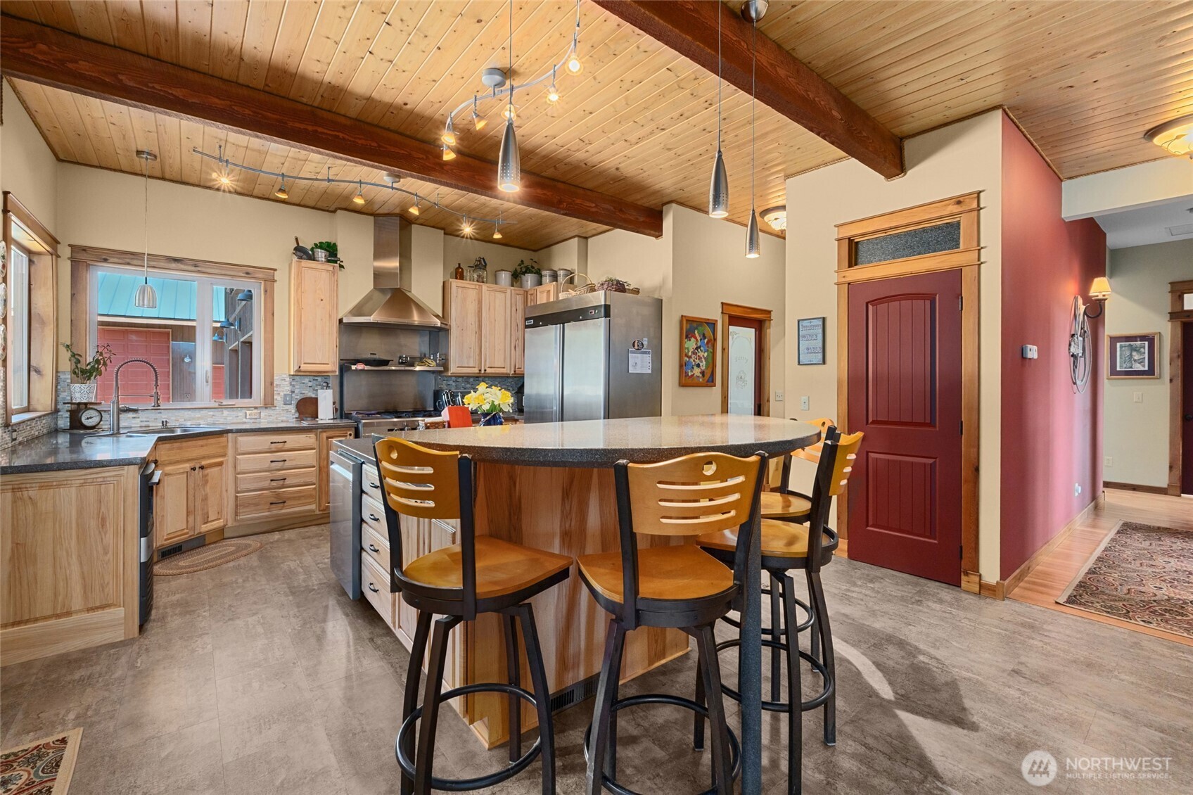 40 Happy Jack Road Curlew, WA 99118 - Photo 11 of 40 a dining area with stainless steel appliances kitchen island a table and chairs