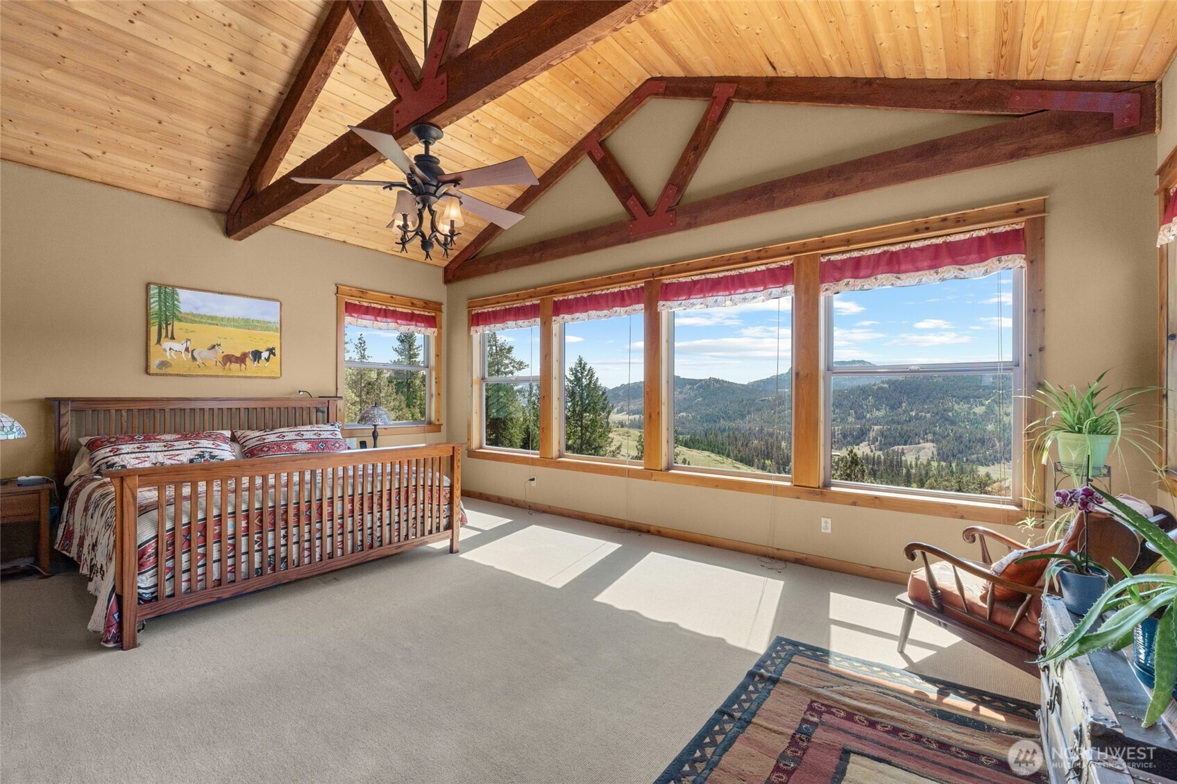 40 Happy Jack Road Curlew, WA 99118 - Photo 14 of 40 a bedroom with furniture and large windows