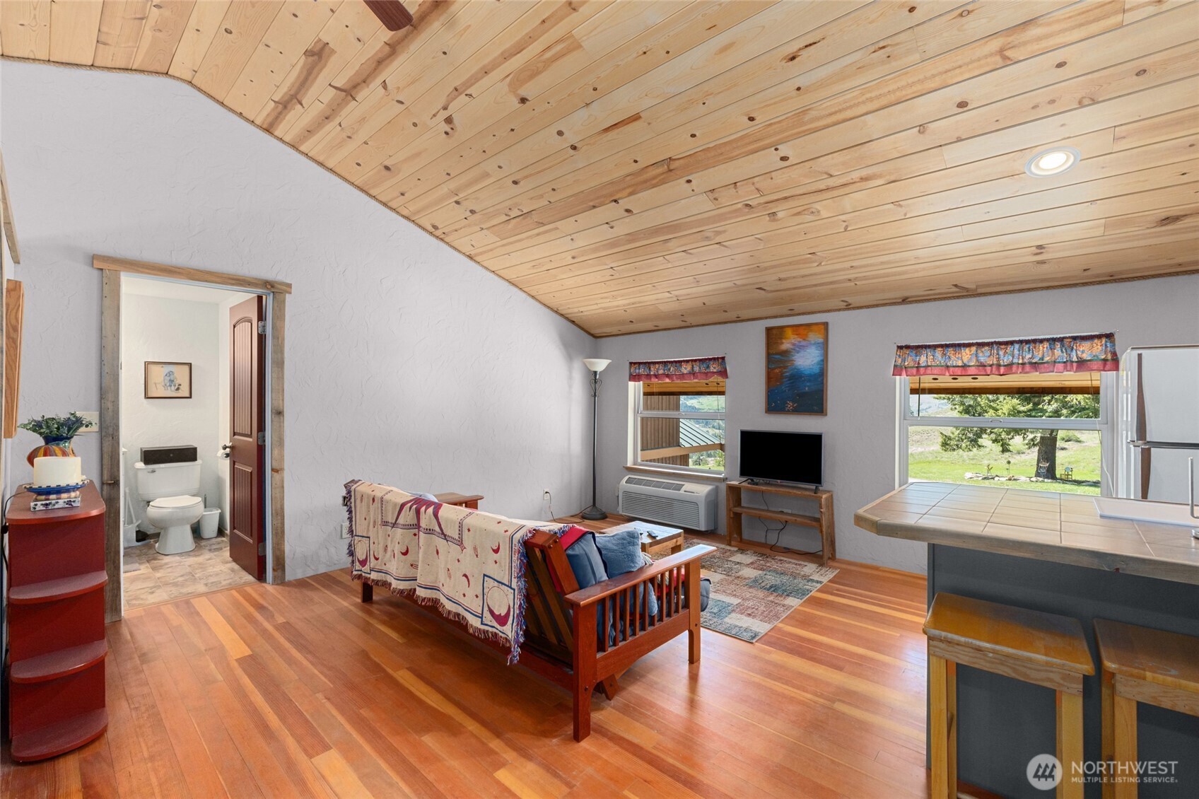 40 Happy Jack Road Curlew, WA 99118 - Photo 22 of 40 a spacious bedroom with a bed a window and dresser