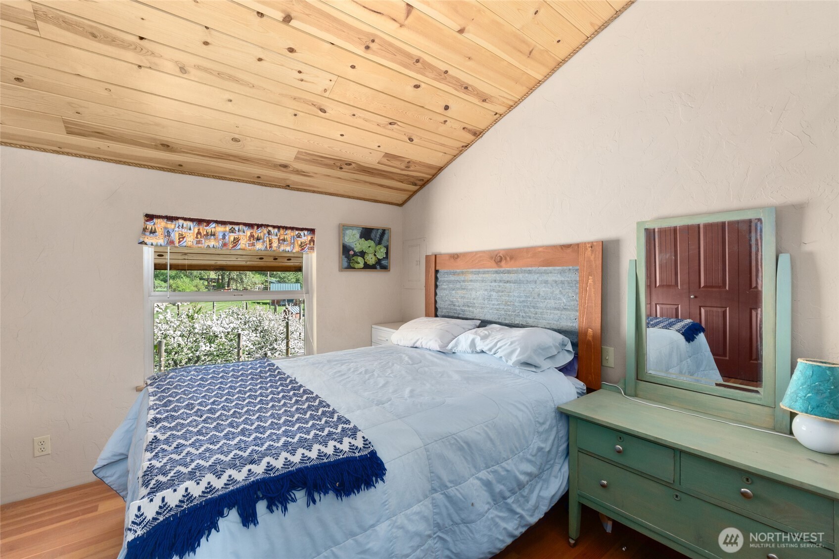 40 Happy Jack Road Curlew, WA 99118 - Photo 25 of 40 a bedroom with a bed and a window