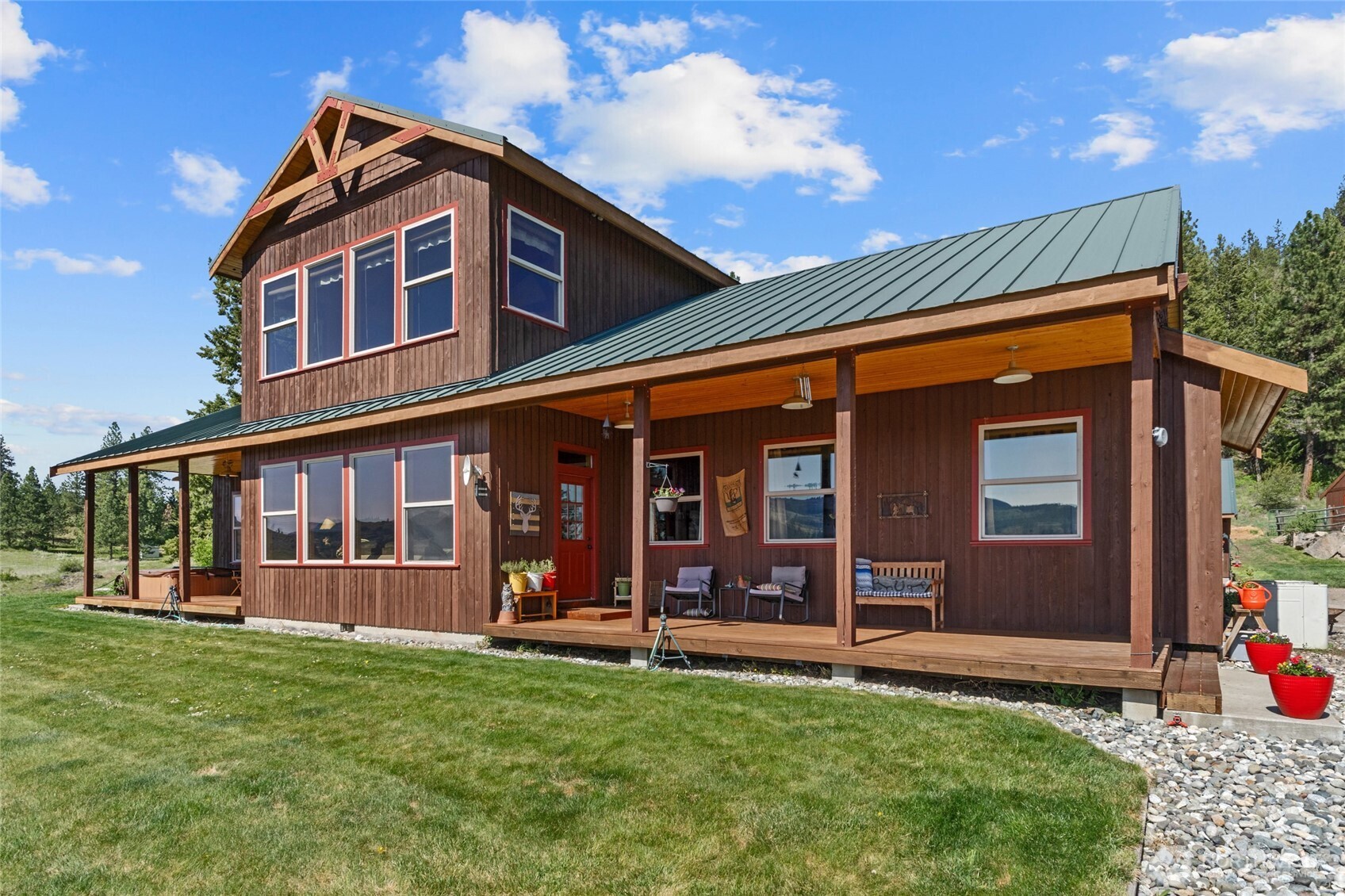 40 Happy Jack Road Curlew, WA 99118 - Photo 5 of 40 front view of a house with a porch