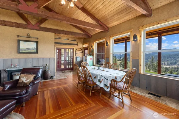 a view of a dining room with furniture window and wooden floor