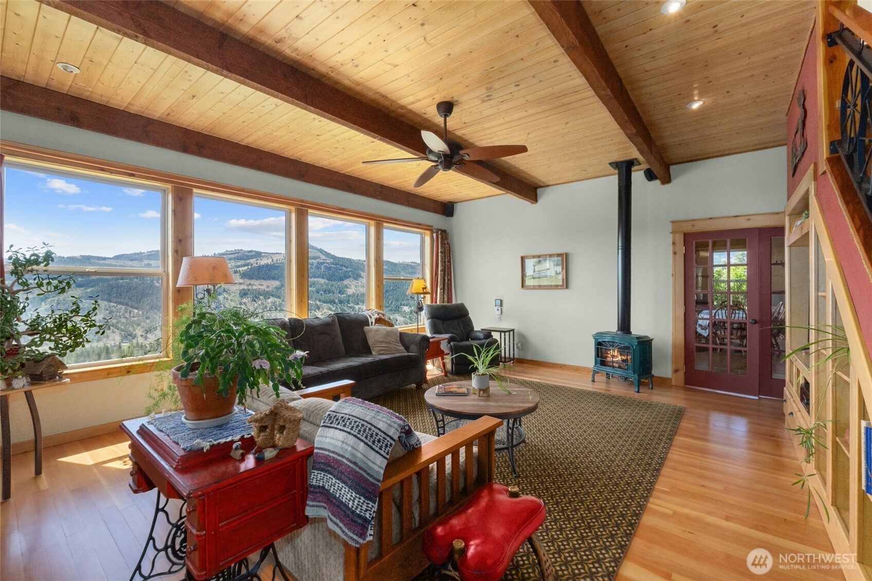 40 Happy Jack Road Curlew, WA 99118 - Photo 9 of 40 a living room with furniture a rug potted plant and a large window