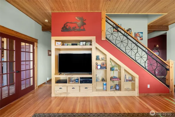 a living room with furniture and a flat screen tv