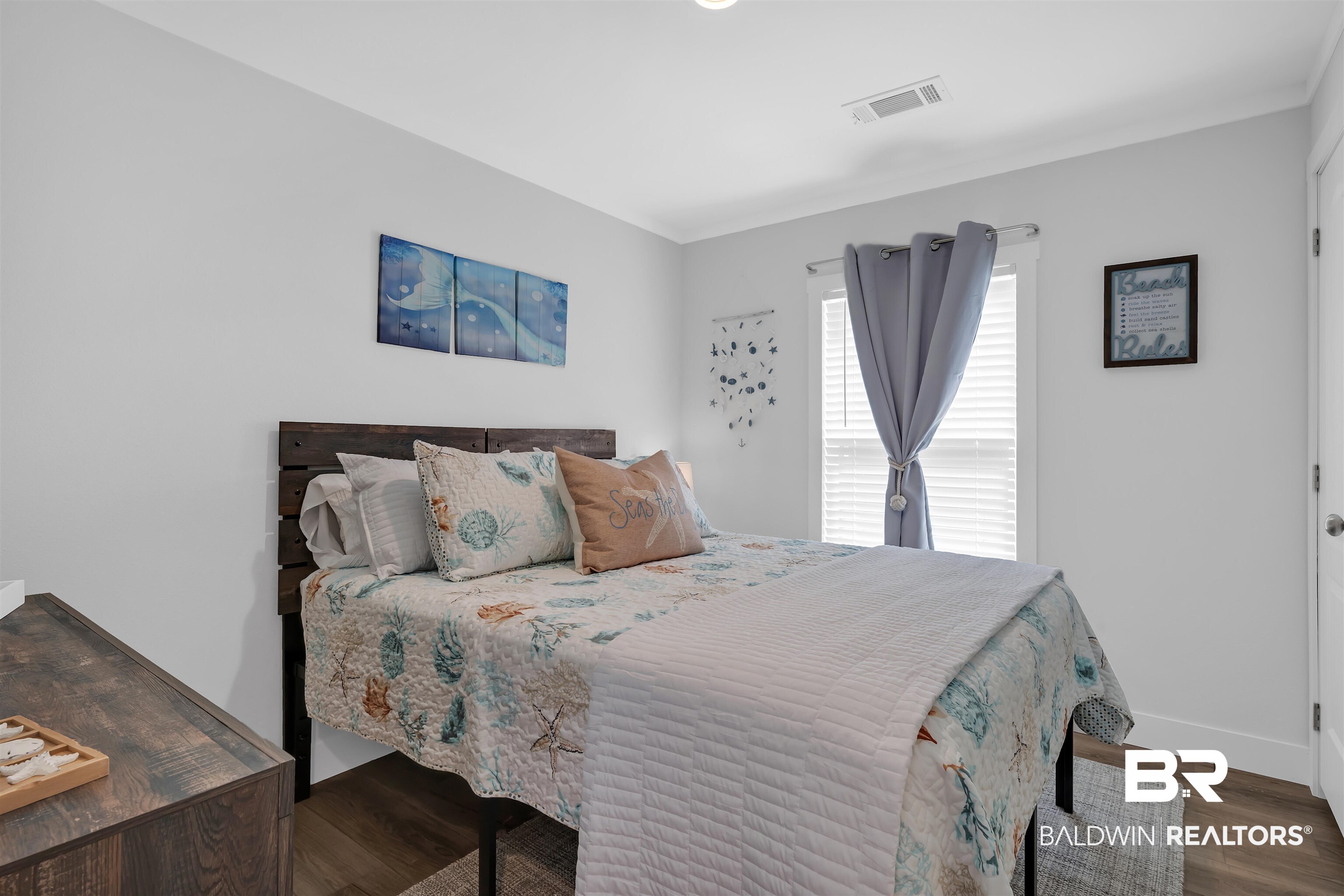 16707 Fort Morgan Road Gulf Shores, AL 36542 - Photo 15 of 22 Bedroom featuring baseboards and wood finished floors