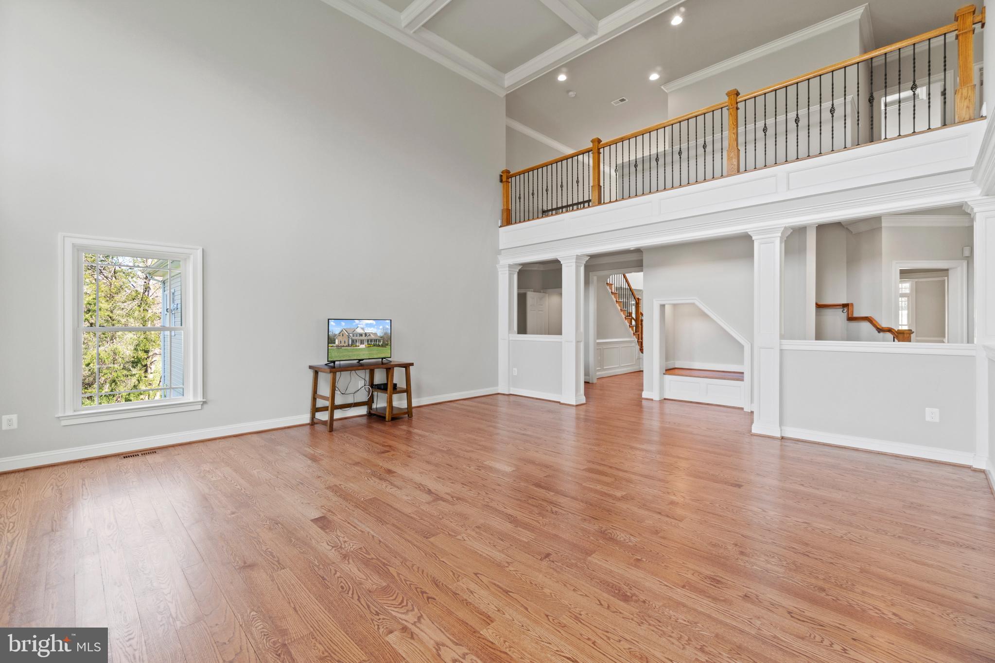 13725 Orlando Road Nokesville, VA 20181 - Photo 20 of 65 a view of an empty room with wooden floor and a window