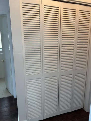 a view of a bathroom with a white door