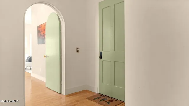 a view of a bedroom from a hallway