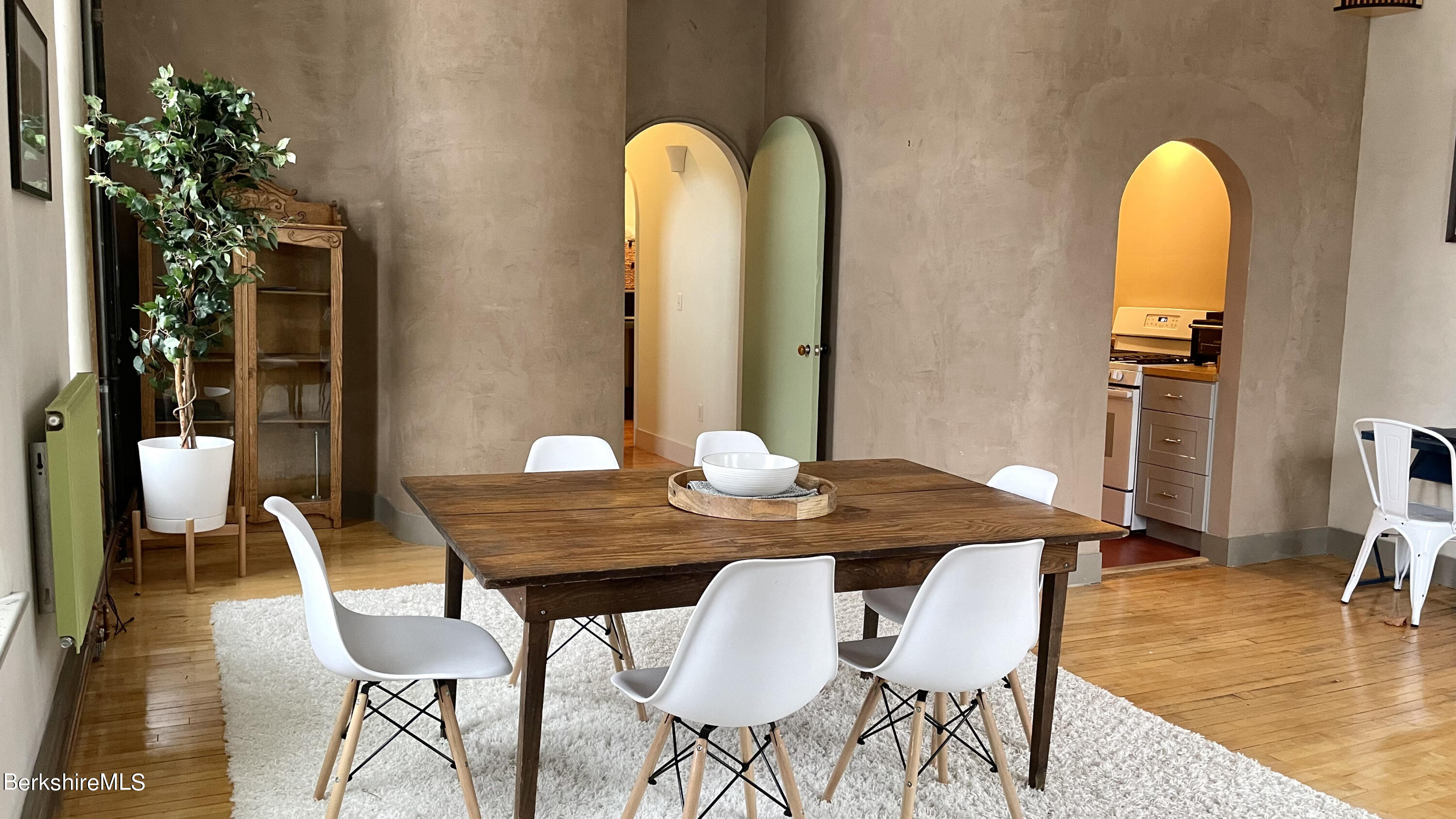 264 Main Street, Unit B Great Barrington, MA 01230 - Photo 15 of 26 a view of a dining room with furniture and wooden floor