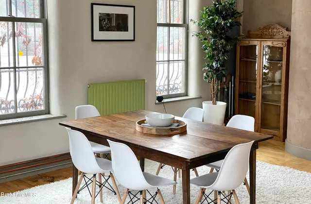 a view of a dining room with furniture window and outside view