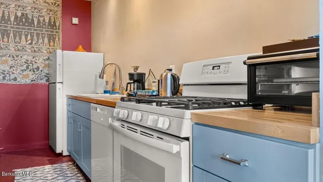 a kitchen with a stove and a microwave