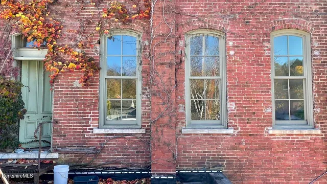 a couple of potted plants in front of a door