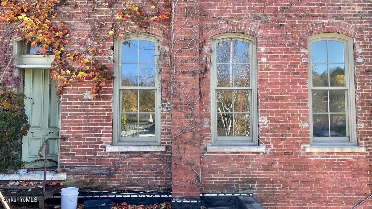 264 Main Street, Unit B Great Barrington, MA 01230 - Photo 24 of 26 a couple of potted plants in front of a door
