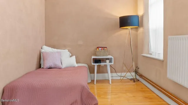 a room with a bed and a chair